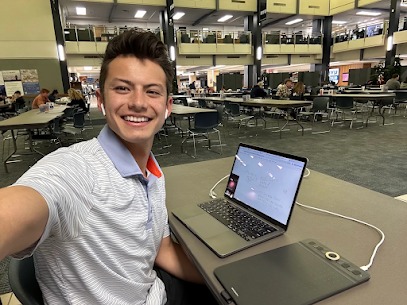 Tutor smiling at a laptop, ready for an online tutoring session